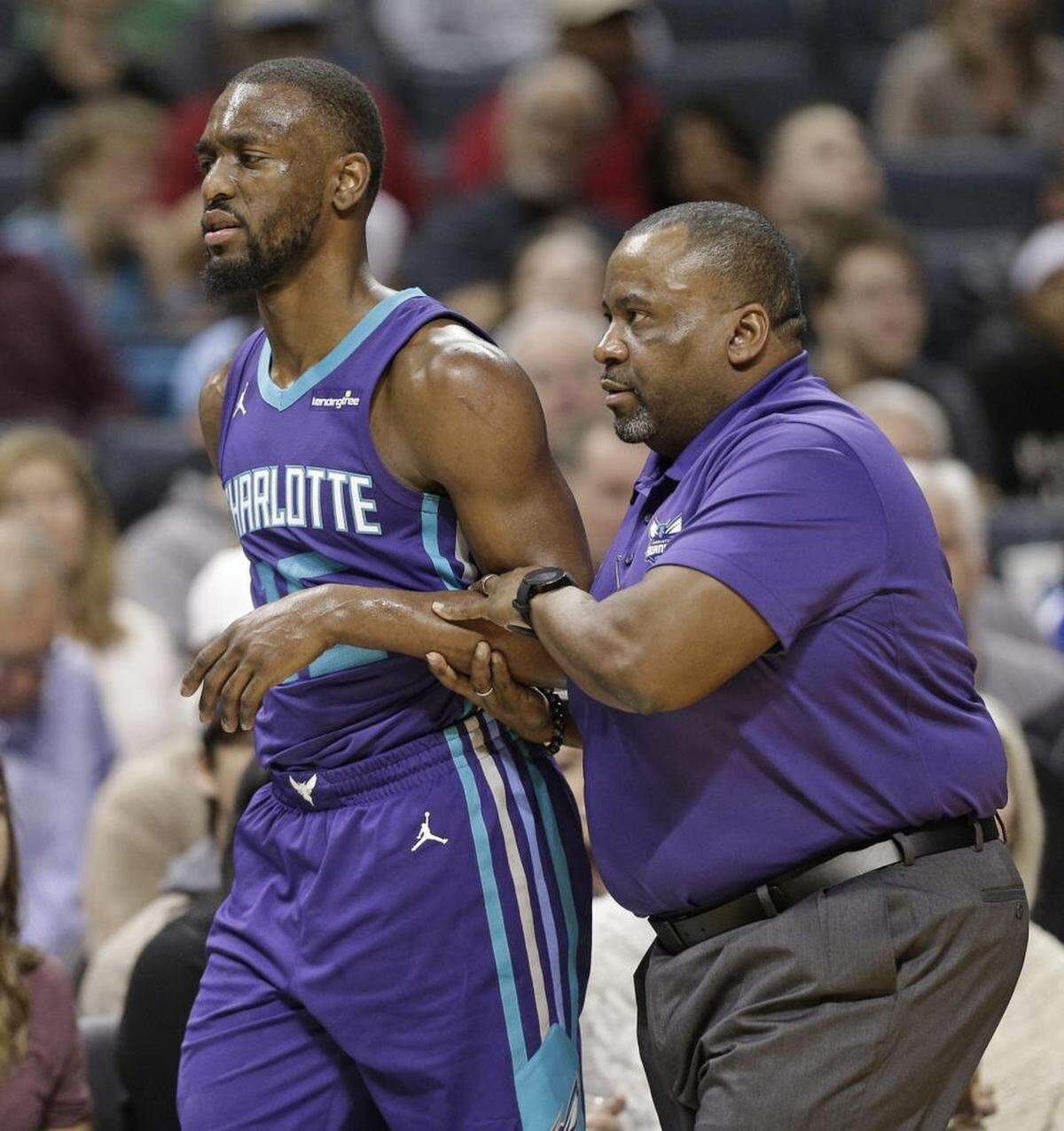 Charlotte Hornets guard Kemba Walker (15) left Saturday’s game against the San Antonio Spurs in the third quarter with a bruised left shoulder. Walker returned to the Hornets’ bench a few minutes later.