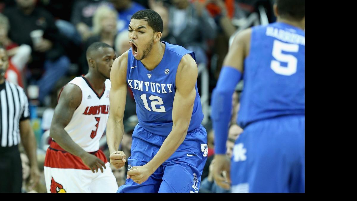 
Karl-Anthony Towns #12 of the Kentucky Wilcats celebrates during the game against the Louisville Cardinals at KFC YUM! Center on December 27, 2014 in Louisville, Kentucky.
