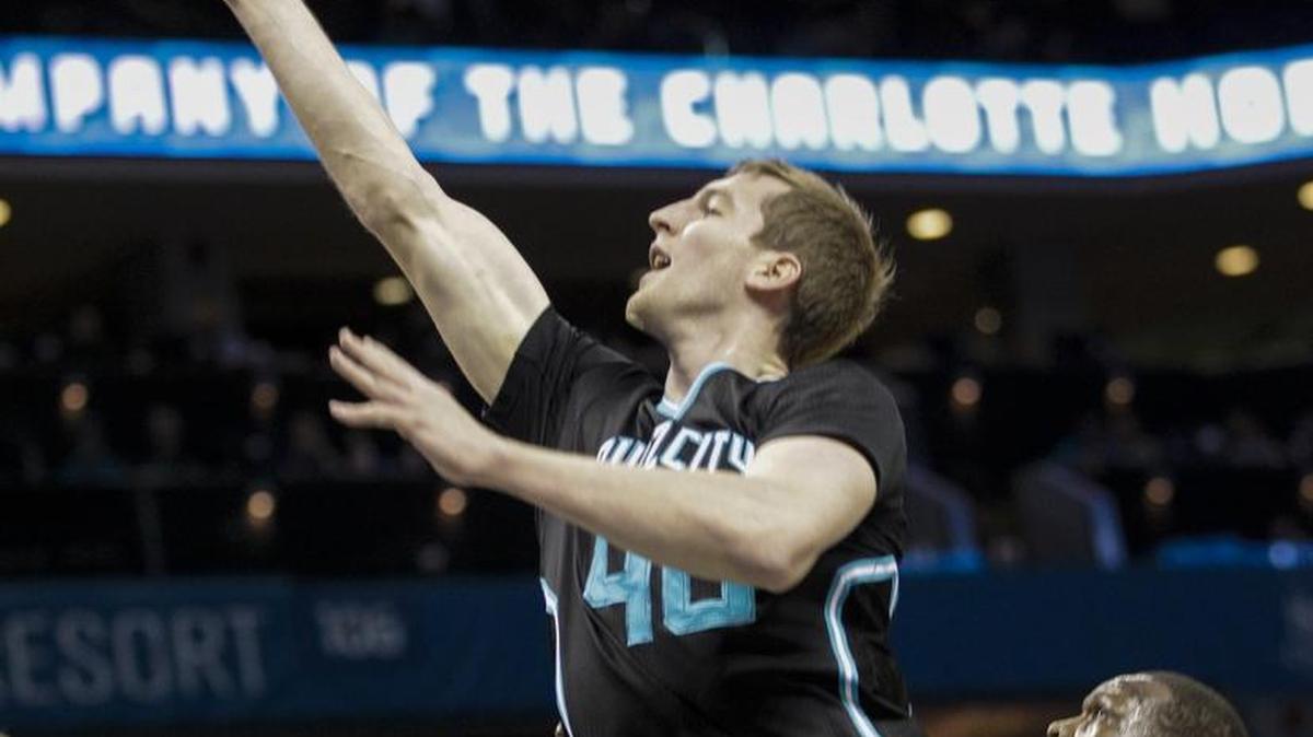 Charlotte Hornets forward Cody Zeller shoots as Miami Heat forward Luol Deng, right, looks on in Friday’s game in Charlotte.