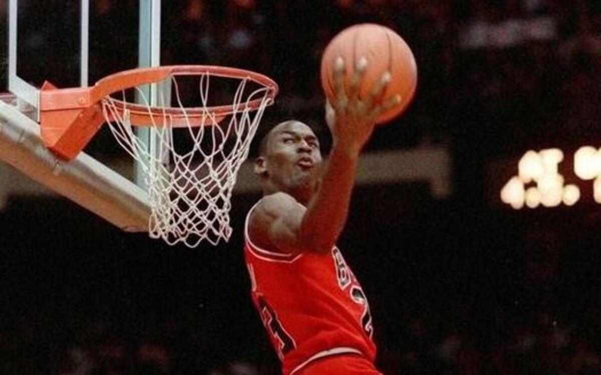 FILE --Michael Jordan of the Chicago Bulls dunks during the slam-dunk competition of the NBA All-Star weekend in Chicago, Ill., on Saturday, Feb. 6, 1988. (AP Photo/John Swart)