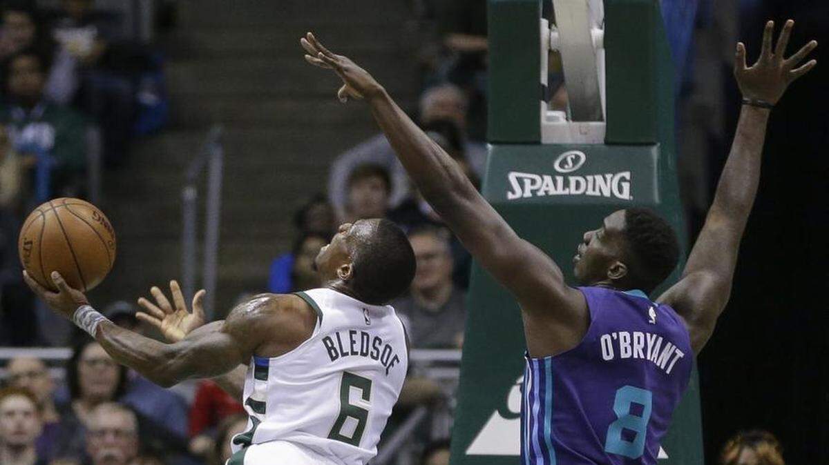 Milwaukee Bucks guard Eric Bledsoe puts up a shot against Charlotte Hornets forward Johnny O'Bryant III during the first half of Friday’s game.