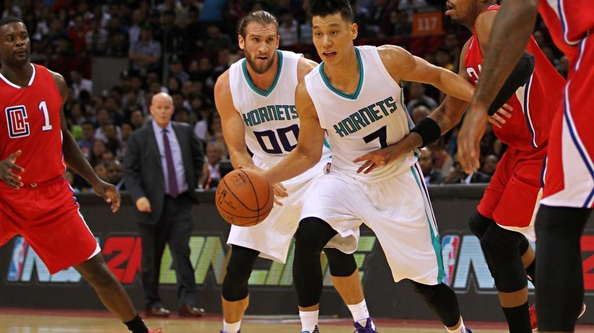 
SHENZHEN, CHINA - OCTOBER 11: Jeremy Lin #7 of Charlotte Hornets handles the basketball against Paul Pierce #34 of Los Angeles Clippers during the match between Charlotte Hornets and Los Angeles Clippers as part of the 2015 NBA Global Games China at Universiade Centre on October 11, 2015 in Shenzhen, China.

