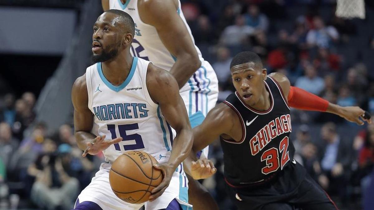 Charlotte Hornets point guard Kemba Walker (15) prepares to shoot a 3-pointer in Tuesday’s home game against the Chicago Bulls.