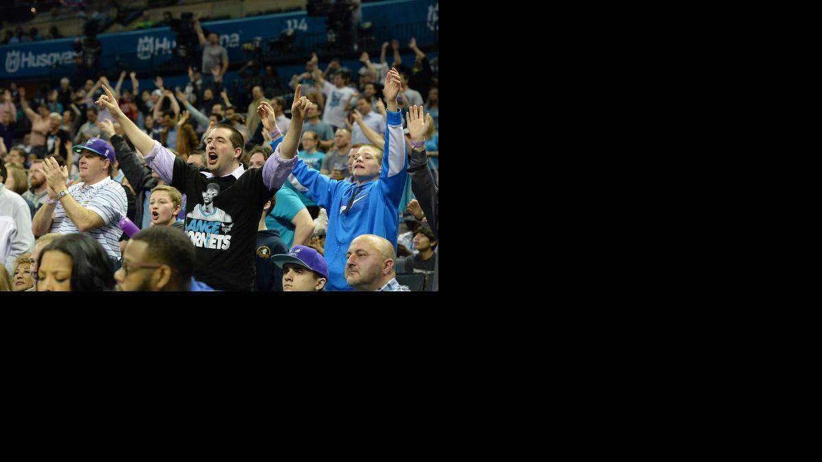 
 Charlotte Hornets fans cheer for their team during Wednesday night's game at Time Warner Cable Arena, March11, 2015. The Sacramento Kings defeated the Charlotte Hornets 113-106.
