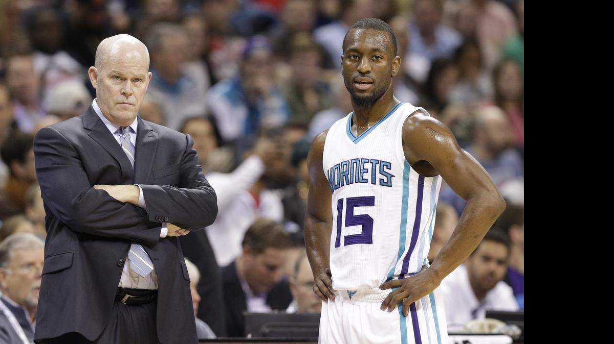 
Point guard Kemba Walker, here with coach Steve Clifford, has a four-season, $48 million contract that is the only significant guarantee on the Charlotte Hornets’ salary cap beyond next season.
