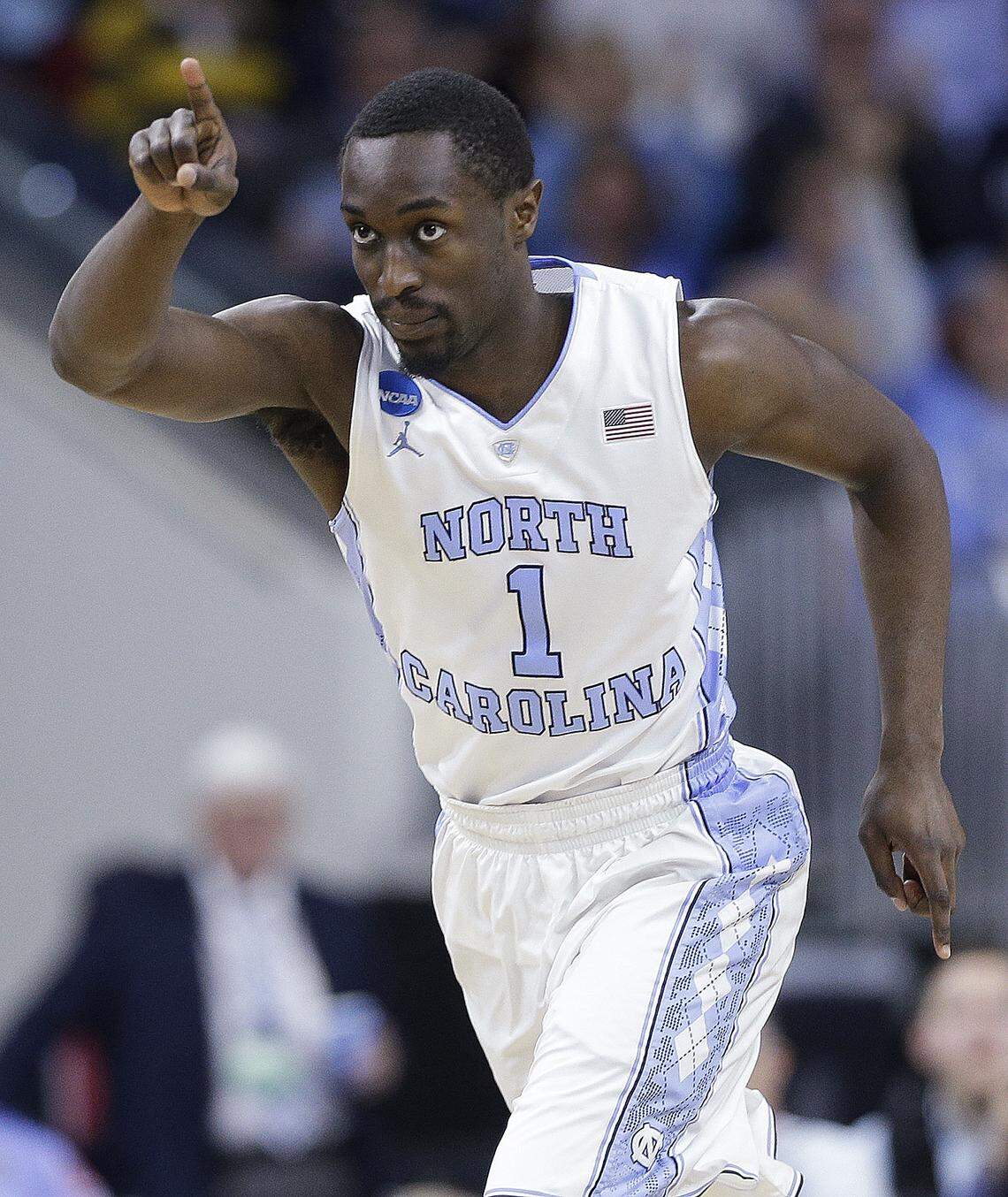 FILE - In this March 19, 2016, file photo, North Carolina forward Theo Pinson celebrates a field goal against Providence during the first half of a second-round men's college basketball game in the NCAA Tournament in Raleigh, N.C. Paige said rotating in and out of a smaller lineup allows the Tar Heels to match up with different styles of play in the tournament. (AP Photo/Chuck Burton, File)