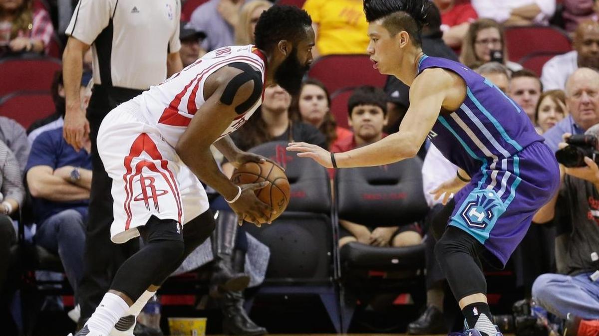 Houston Rockets guard James Harden (13) looks to dribble around Charlotte Hornets guard Jeremy Lin (7) in the first half of an NBA basketball game Monday, Dec. 21, 2015, in Houston.