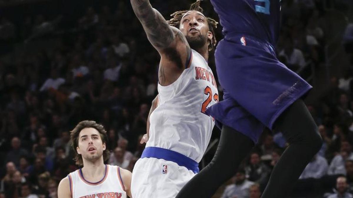 Charlotte Hornets' Jeremy Lamb (3) drives past New York Knicks' Derrick Williams (23) as Sasha Vujacic (18) watches during the first half of an NBA basketball game Wednesday, April 6, 2016, in New York.