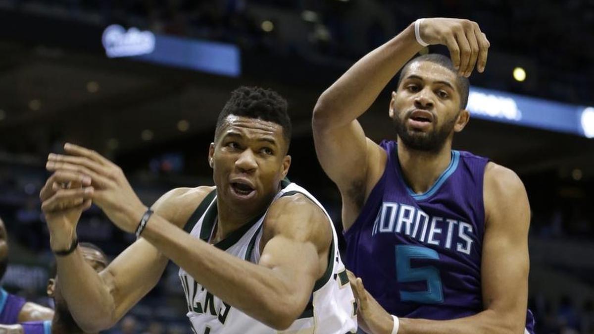 Charlotte Hornets forward Nicolas Batum (5) blocks a shot attempt by the Milwaukee Bucks' Giannis Antetokounmpo during a March 26 game in Milwaukee.