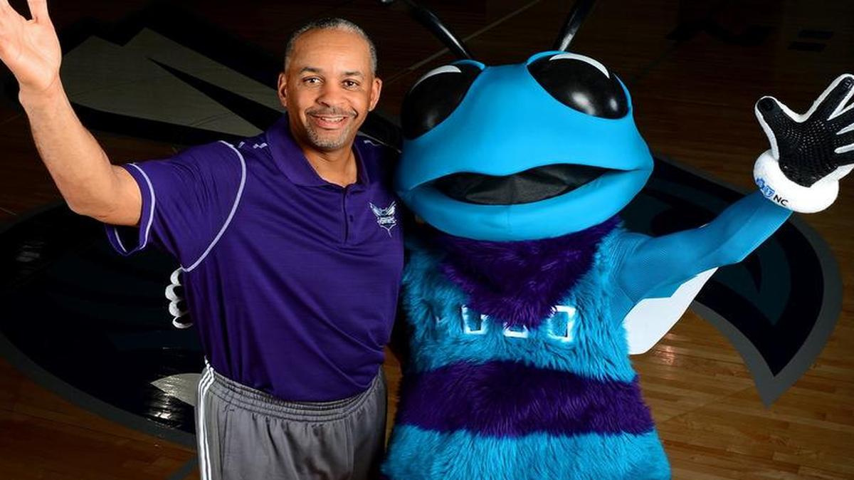 
Former Charlotte Hornets star Dell Curry, pictured here last fall with Hugo, is going to work for the franchise as a team ambassador and special projects advisor.
