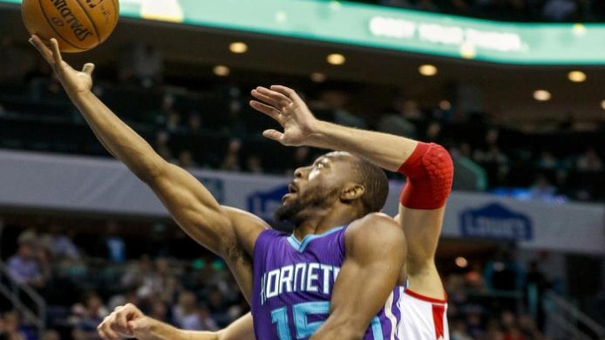 Charlotte Hornets guard Kemba Walker drives to the basket against the Toronto Raptors in the first half of Friday’s NBA game. Toronto won 113-111.
