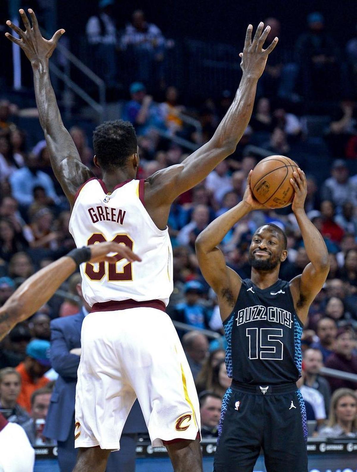 Kemba Walker, right, is generously listed at 6-foot-1 but routinely scores inside against much bigger players due to his quickness.