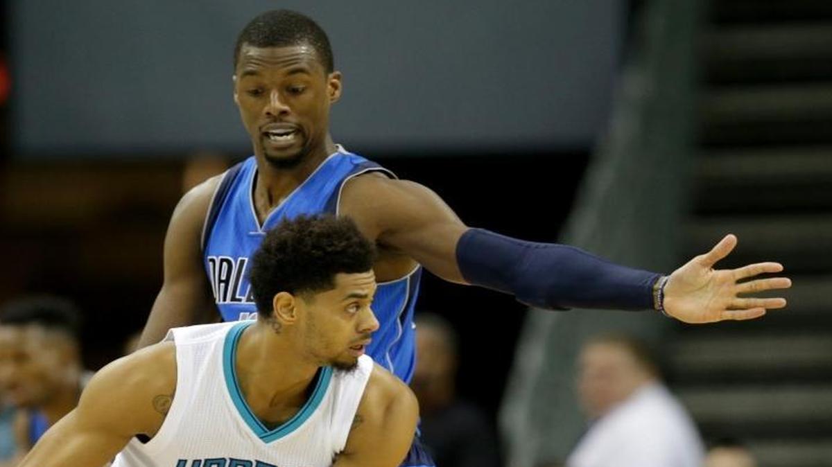 Dallas Mavericks small forward Harrison Barnes, the former North Carolina standout, defends against the Charlotte Hornets’ Jeremy Lamb (3) Thursday night in Charlotte. Barnes, in his first season with the Mavericks after four seasons with the Golden State Warriors, averages a team-high 20.3 points.