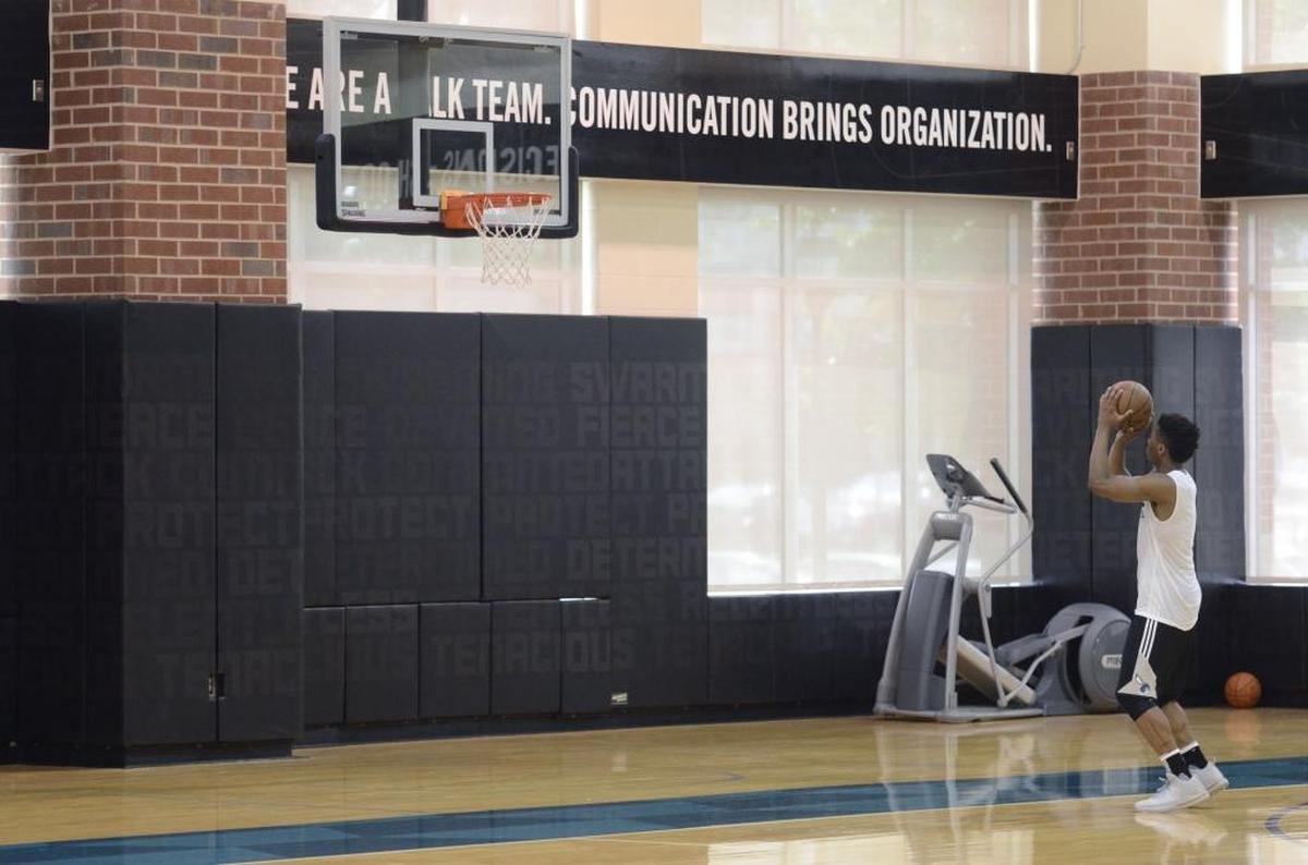 Former Louisville guard Donovan Mitchell shoots on his own after a pre-draft workout with the Charlotte Hornets on Monday at the Spectrum Center. There were six prospects worked out on Monday including former Louisville guard Donovan Mitchell and former Adelaide 36ers player Terrance Ferguson. Photos were made at Spectrum Center on June 12, 2017.