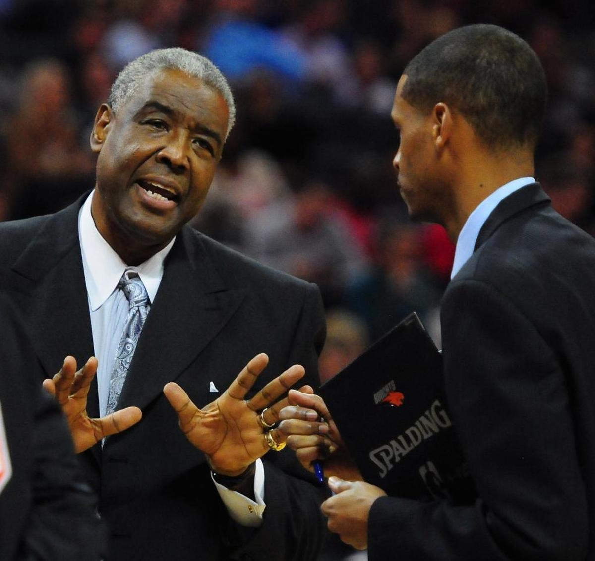 Stephen Silas (right) came into the NBA working for his father, Paul (left), who had two stints coaching in Charlotte.