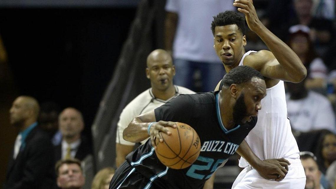 Miami Heat center Hassan Whiteside, right, can be the Heat’s rim-protector only so long as he stays out of foul trouble. It’s Charlotte Hornets center Al Jefferson’s job to draw those fouls.