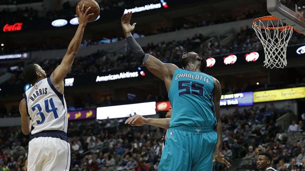 Dallas Mavericks guard Devin Harris (34) launches a shot against Roy Hibbert (55) of the Charlotte Hornets during Monday night’s game.