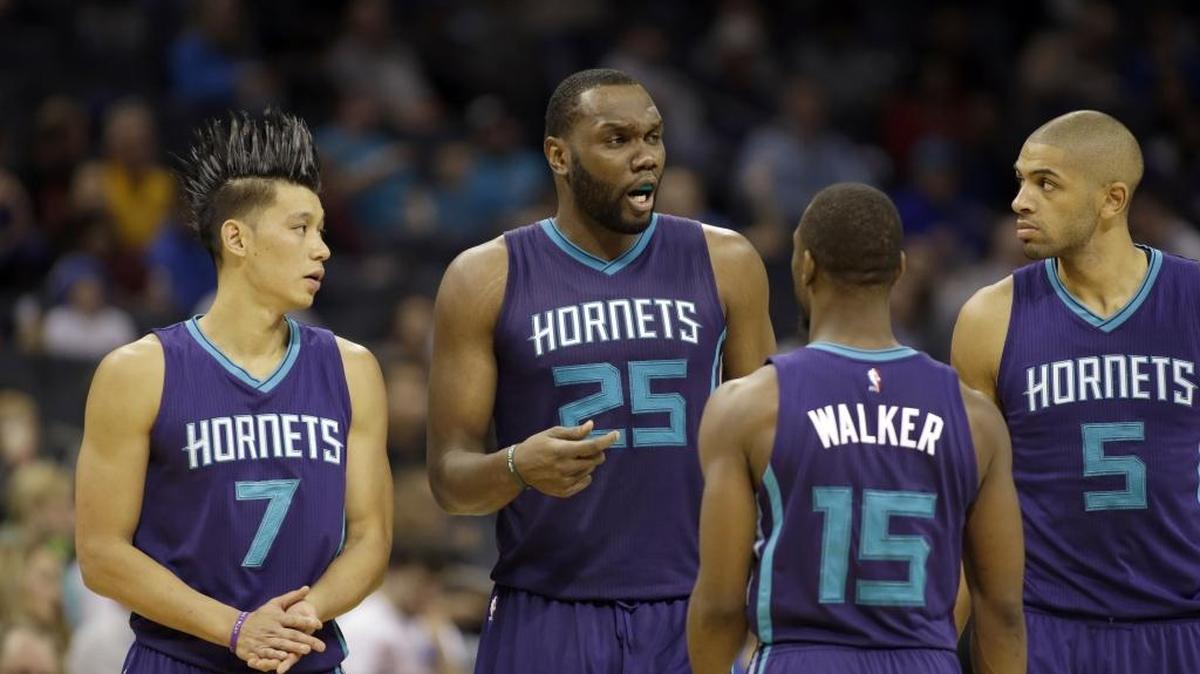 Charlotte Hornets' Al Jefferson (25) gets a point across to teammates, Jeremy Lin (7), Kemba Walker (15) and Nicolas Batum (5) in the second half of Friday’s 113-88 win over the Philadelphia 76ers.