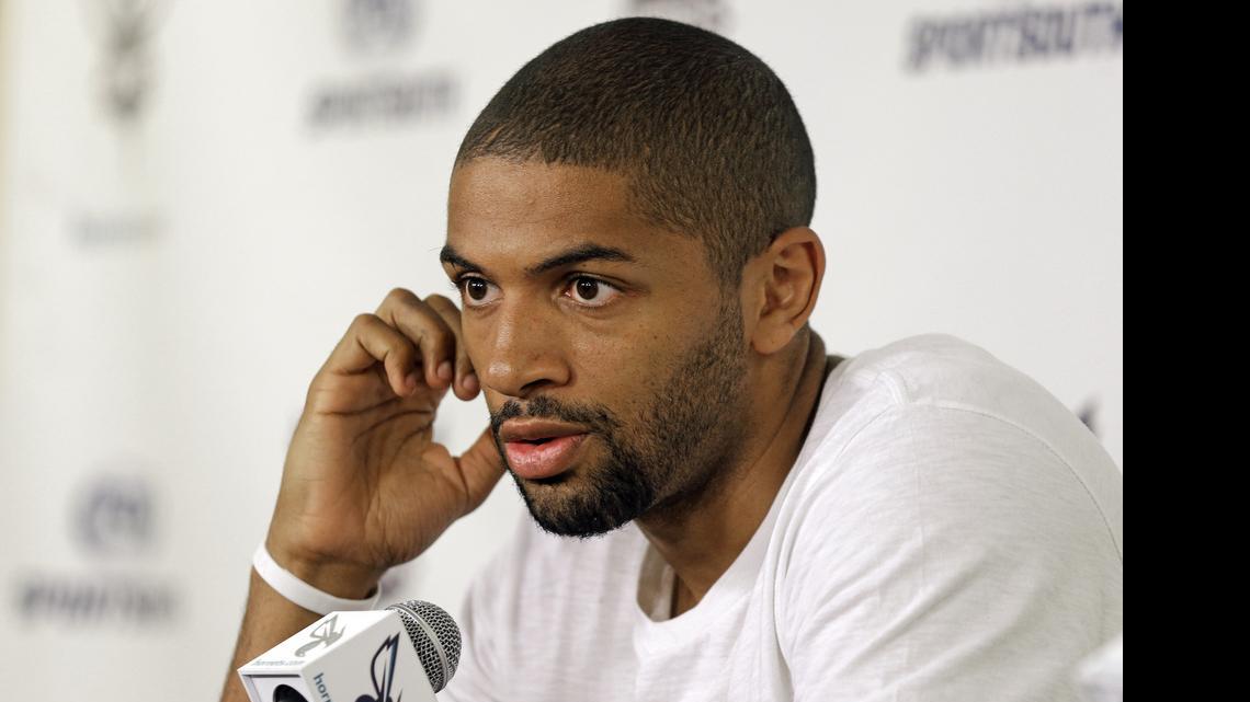 
Charlotte Hornets' newly acquired player Nicolas Batum answers a question during a new conference Friday Time Warner Cable Arena. 
