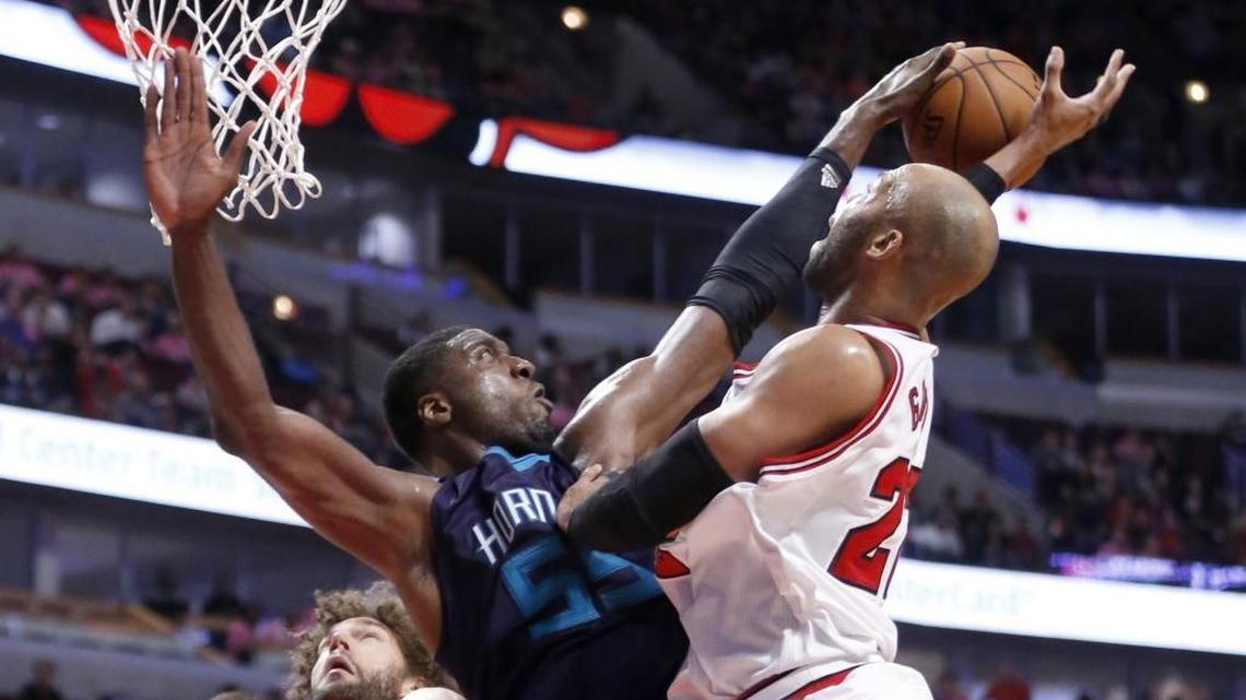 Charlotte Hornets center Roy Hibbert (left), pictured in a preseason exhibition against Chicago, has a sore right knee and isn’t expected to play Friday at Brooklyn.