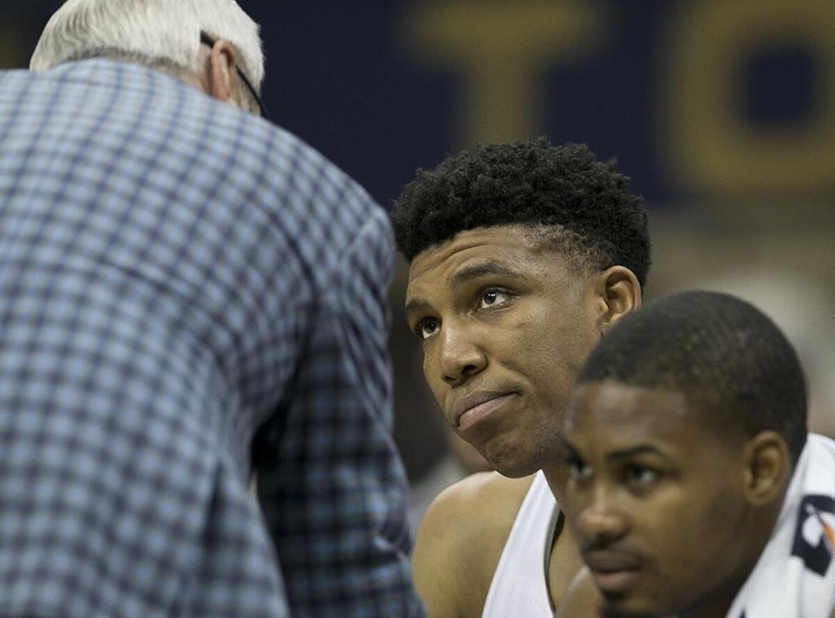 North Carolina’s Tony Bradley, center, chose to stay in this draft rather than return to Chapel Hill.