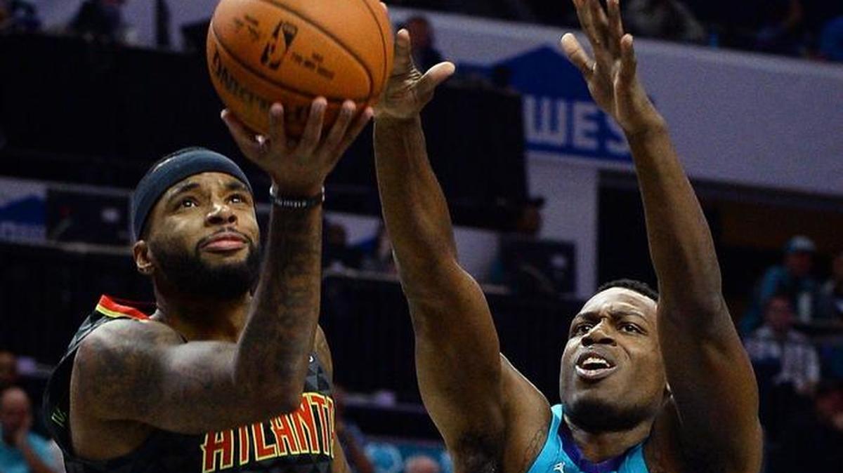Charlotte Hornets forward Treveon Graham, right,has a contract for this season that becomes guaranteed if he is still on the roster Jan. 10, as expected.