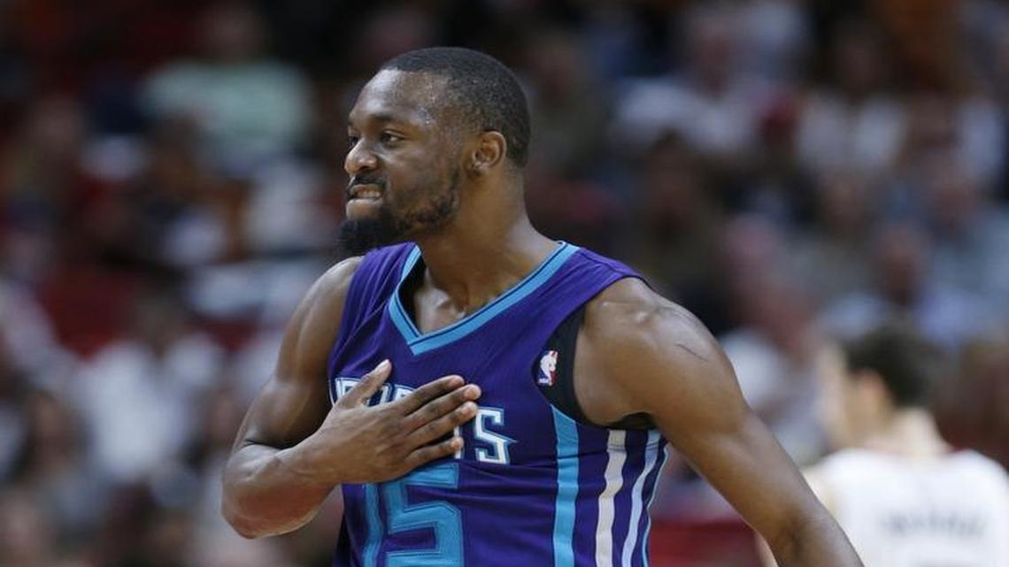 Charlotte Hornets guard Kemba Walker celebrates after scoring during the second half of Friday’s NBA basketball game against the Miami Heat. Walker scored 24 points as the Hornets defeated the Heat 97-91.