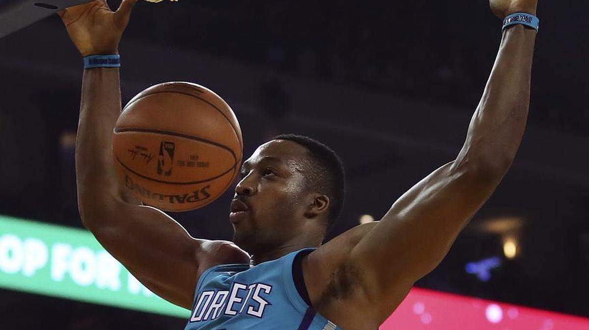 Charlotte Hornets center Dwight Howard scored a season-high 29 points and totaled a career-high seven assists to upset the NBA champion Golden State Warriors 111-100.