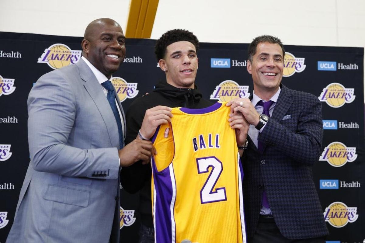 The NBA fined the Los Angeles Lakers $500,000 Thursday for violating the rule against tampering. The accusation involved Lakers executives Magic Johnson (left) and Rob Pelinka (right).