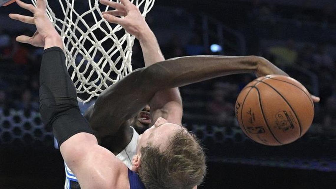 Orlando Magic forward Serge Ibaka blocks a shot by Charlotte Hornets center Cody Zeller (40) during the first half of Wednesday’s NBA game in Orlando, Fla.