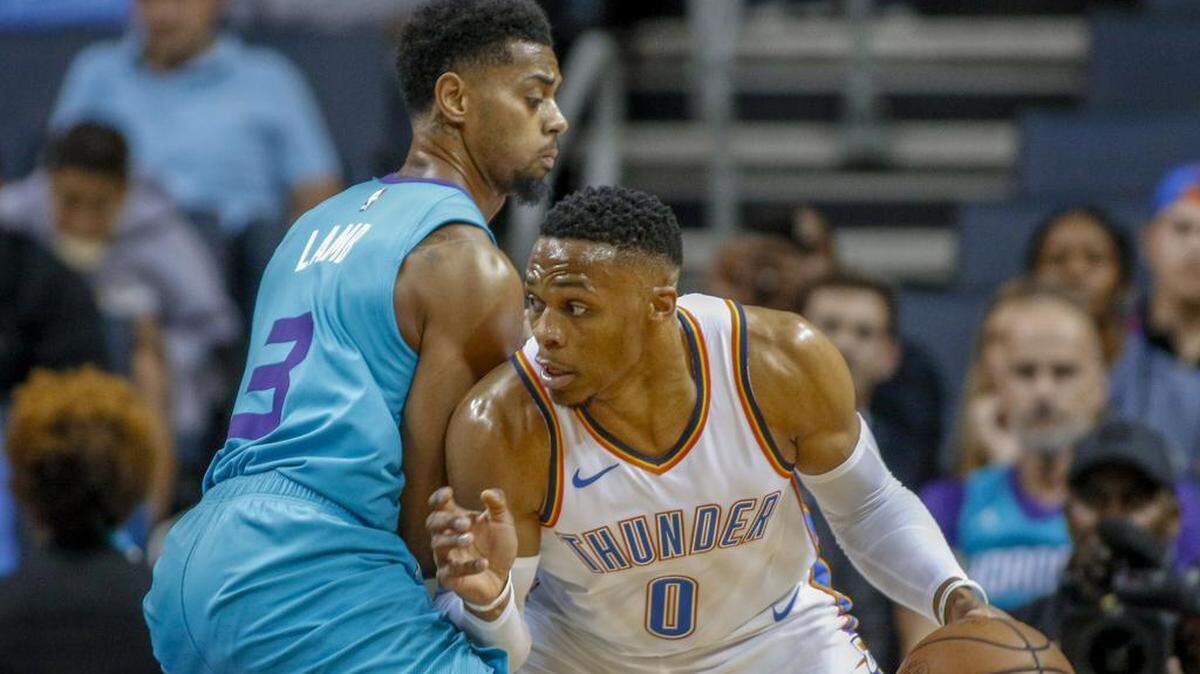 Oklahoma City Thunder guard Russell Westbrook, right, drives against Charlotte Hornets guard Jeremy Lamb during the first half of Thursday’s NBA game at the Spectrum Center. Oklahoma City won 111-107.