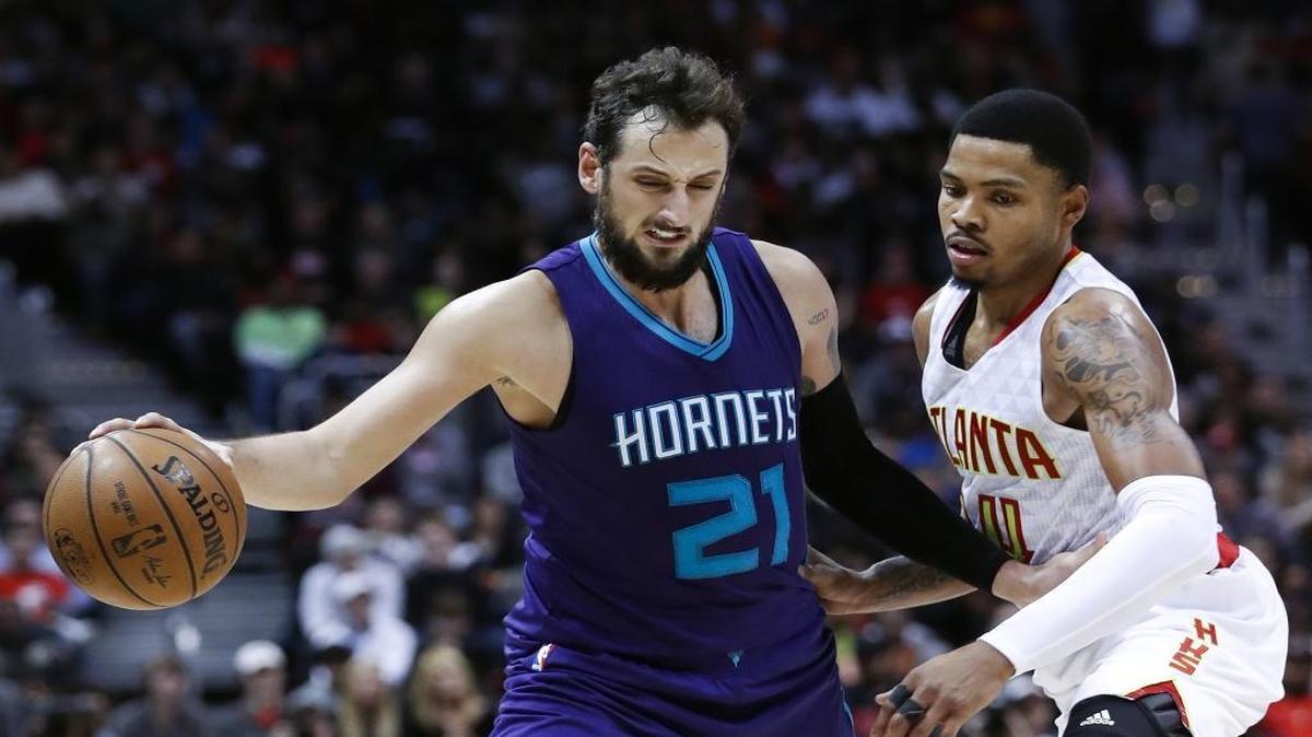 Charlotte Hornets guard Marco Belinelli (21) works against Atlanta Hawks forward Kent Bazemore (24) in the second half of Saturday’s game.