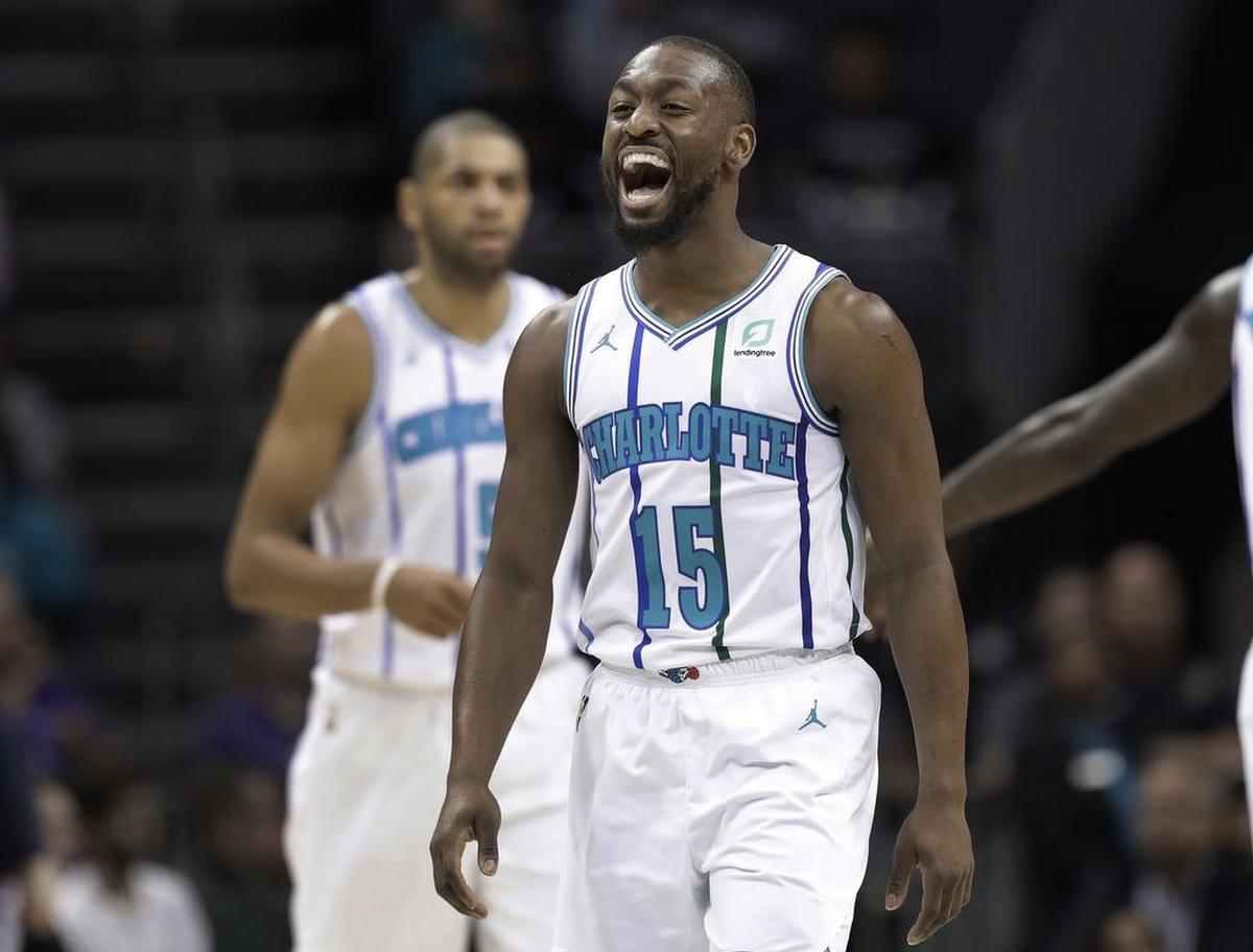 Charlotte Hornets point guard Kemba Walker celebrates after making a basket against Brooklyn during Saturday night’s game at the Spectrum Center. Walker led the Hornets with 29 points.