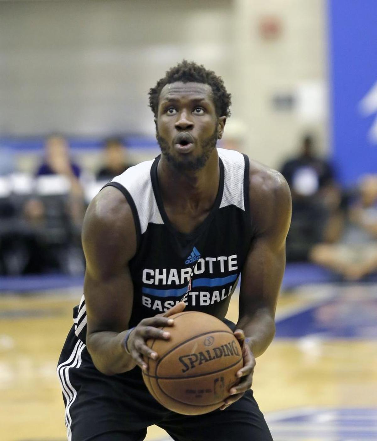 Former Louisville center Mangok Mathiang played for the Charlotte Hornets’ summer league team in Orlando, Fla., last month. The Hornets will sign Mathiang to one of the NBA’s new two-way contracts, meaning he will play primarily for the Greensboro Swarm, the Hornets’ G-League affiliate.