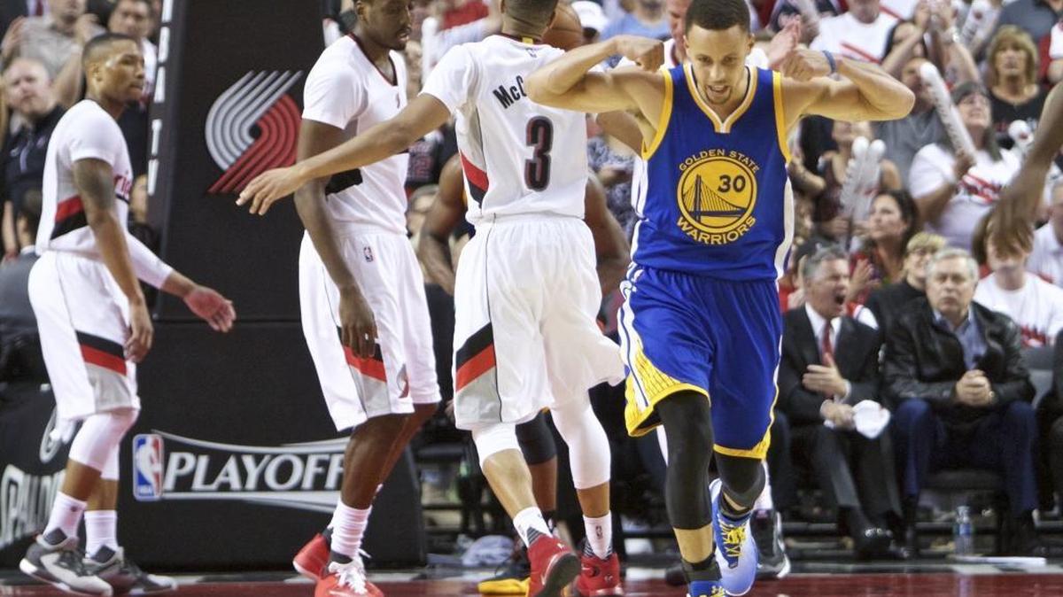 Golden State Warriors guard Stephen Curry (30) reacts after scoring a basket against the Portland Trail Blazers during the second half of Monday’s playoff game. The Warriors won 132-125 to take a 3-1 lead in the best-of-7 series.
