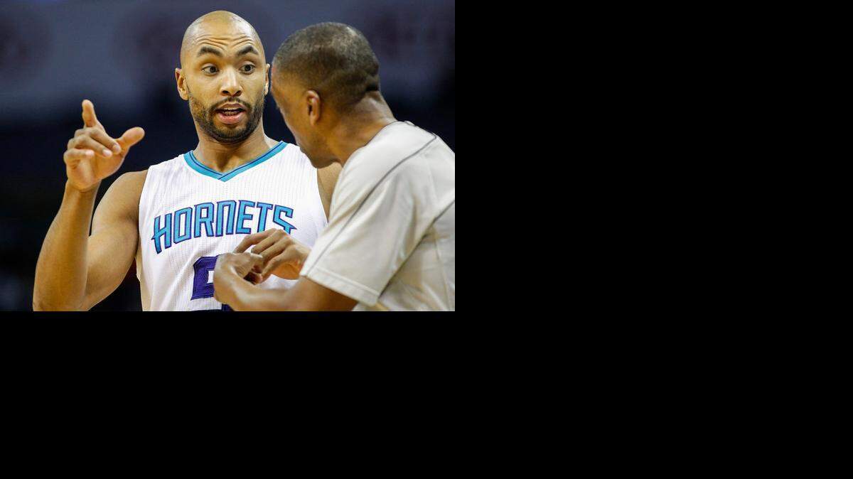 
Charlotte Hornets forward Gerald Henderson, left, argues with official Leon Wood as the Hornets play the Washington Wizards, March 9, 2015 in Charlotte.
