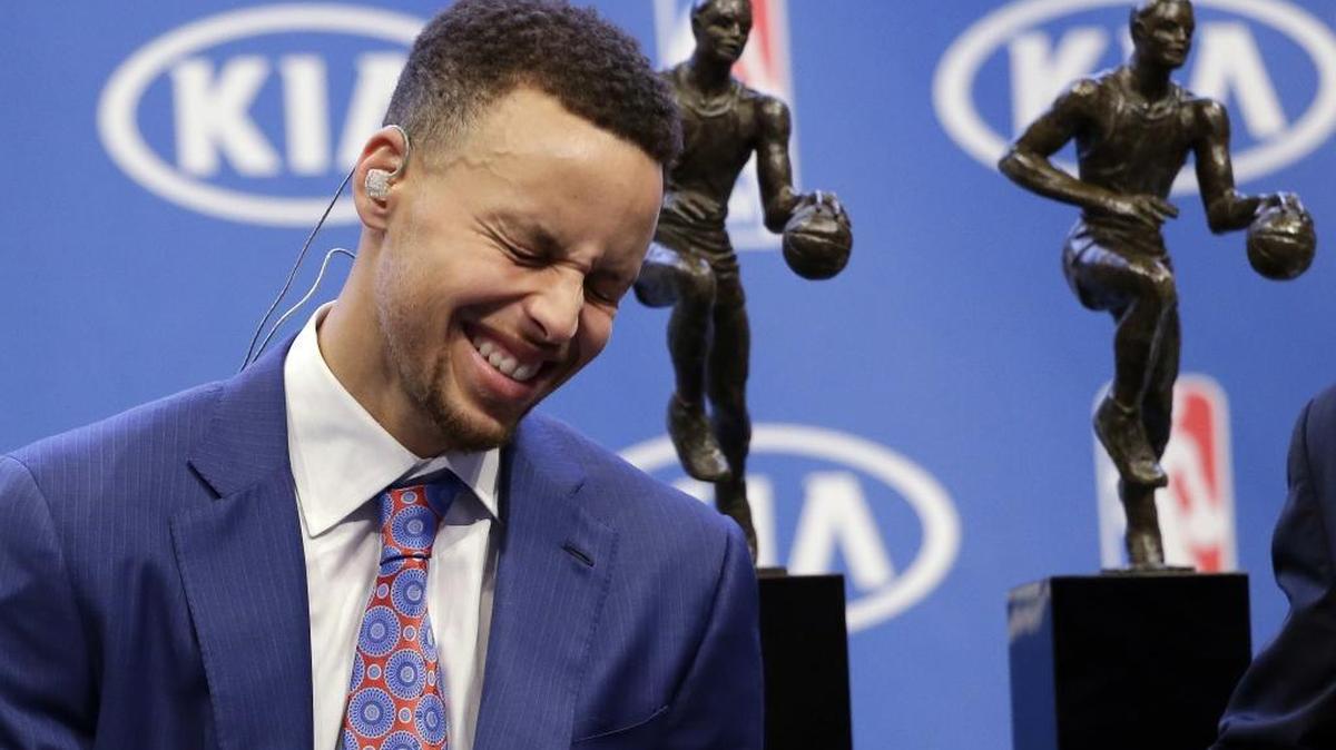 Golden State Warriors guard Stephen Curry smiles as he conducts interviews Tuesday after receiving the NBA's Most Valuable Player award in Oakland, Calif. Curry, a Charlottean, is the first player unanimously voted as most valuable player in the NBA.