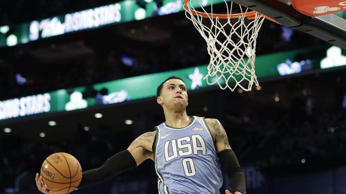 U.S. Team’s Kyle Kuzma, a second-year pro from the Los Angeles Lakers, dunks against the World Team during the NBA All-Star Rising Stars game Friday night at Spectrum Center.