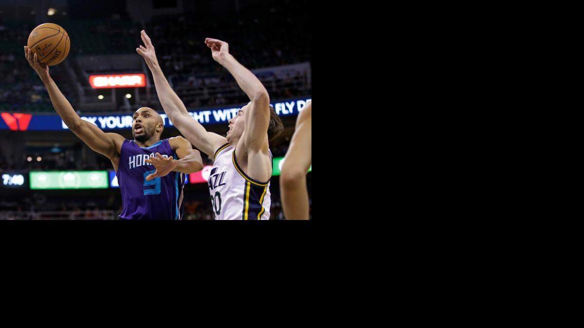 
Utah Jazz forward Gordon Hayward (20) defends against Charlotte Hornets guard Gerald Henderson (9) Monday, March 16, 2015, in Salt Lake City.
