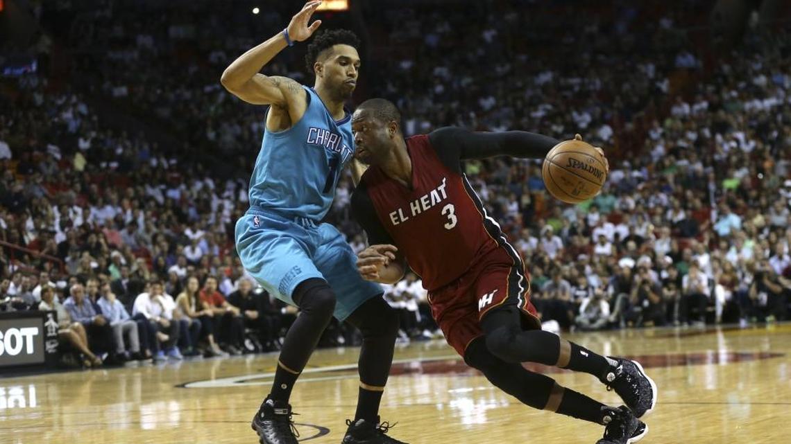 Charlotte Hornets guard Courtney Lee, left, will likely bear the burden of covering Miami Heat guard Dwyane Wade on isolation plays in the teams’ first-round NBA playoffs series.
