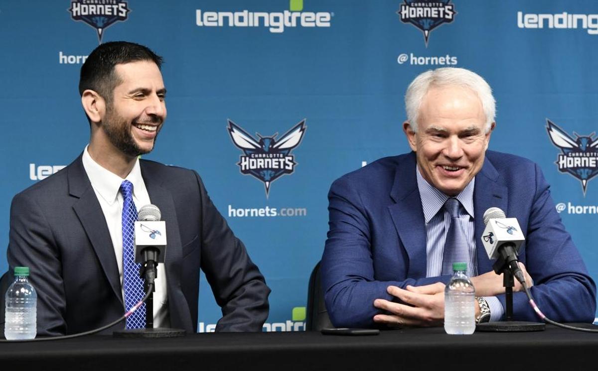 Charlotte Hornets new head coach James Borrego (left) and general manager Mitch Kupchak share a laugh at the start of Borrego's introductory news conference at the Spectrum Center on Friday.