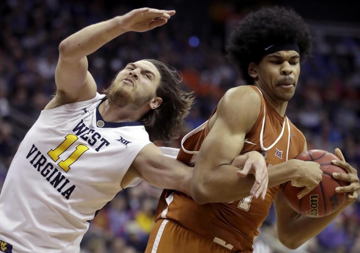 Texas' Jarrett Allen’s, right, incredible reach compensates for so-so height for an NBA center.