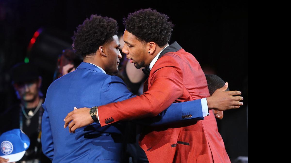 Jahlil Okafor, right, celebrates with Duke teammate Justise Winslow after being selected third overall Thursday night by the Philadelphia 76ers in the first round of the NBA draft. Winslow was selected seven picks later by Miami.