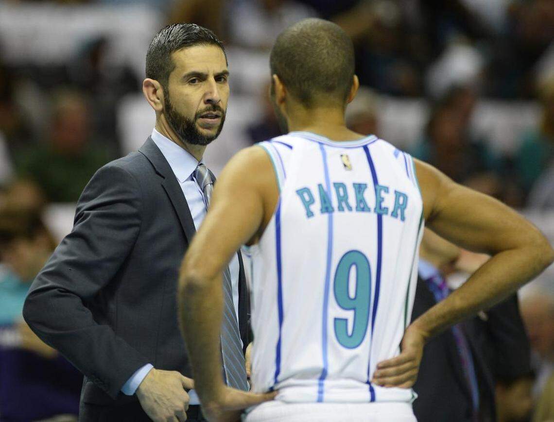 Charlotte Hornets coach James Borrego (left) didn’t intend to play veteran point guard Tony Parker (9) 20 minutes in the opener, but circumstances dictated it. Don’t be surprised if Parker plays little or not at all Saturday in Miami, the second game of a back-to-back set.