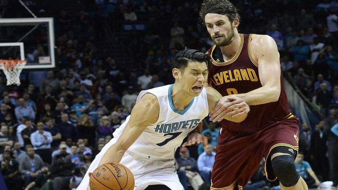 Charlotte Hornets guard Jeremy Lin, left, drives the ball against Cleveland Cavaliers forward Kevin Love during Wednesday night's game. The Hornets defeated Cleveland 106-97.