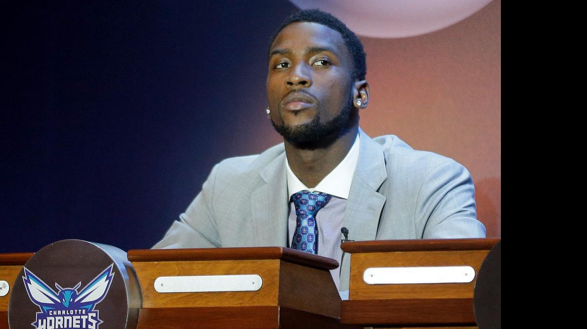 
Michael Kidd-Gilchrist listens for the Charlotte Hornets' spot in the NBA basketball draft, during the draft lottery Tuesday, May 19, 2015, in New York. 

