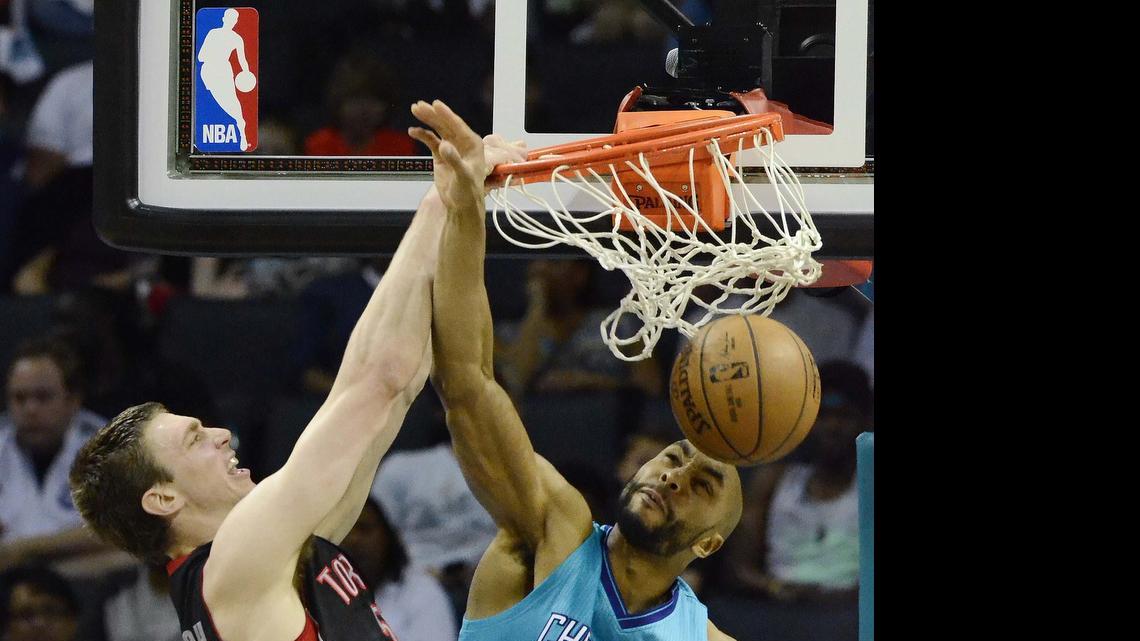 
 Tyler Hansbrough (left), dunks the ball against former Charlotte Hornet Gerald Henderson (right) at Time Warner Cable Arena April 8, 2015. Hansbrough has come to terms with the Hornets.
