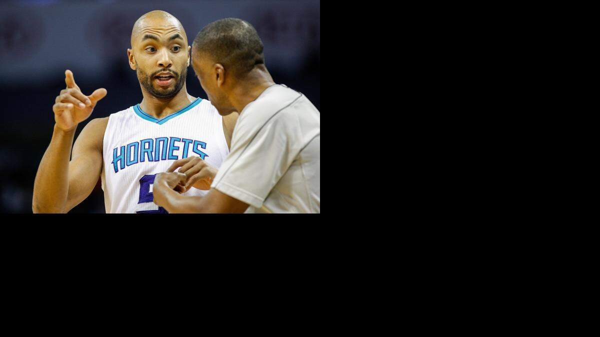 
Charlotte Hornets forward Gerald Henderson, left, argues with official Leon Wood during the Hornets’ game against the Washington Wizards, Monday, March 9, 2015 in Charlotte.
