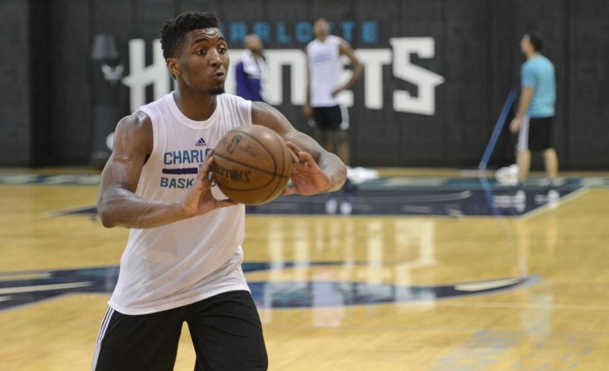 Former Louisville guard Donovan Mitchell feeds former Adelaide 36ers guard Terrance Ferguson's shooting drill during a pre-draft workout with the Charlotte Hornets on Monday at the Spectrum Center. There were six prospects worked out on Monday including Mitchell and Ferguson . Photos were made at Spectrum Center on June 12, 2017.