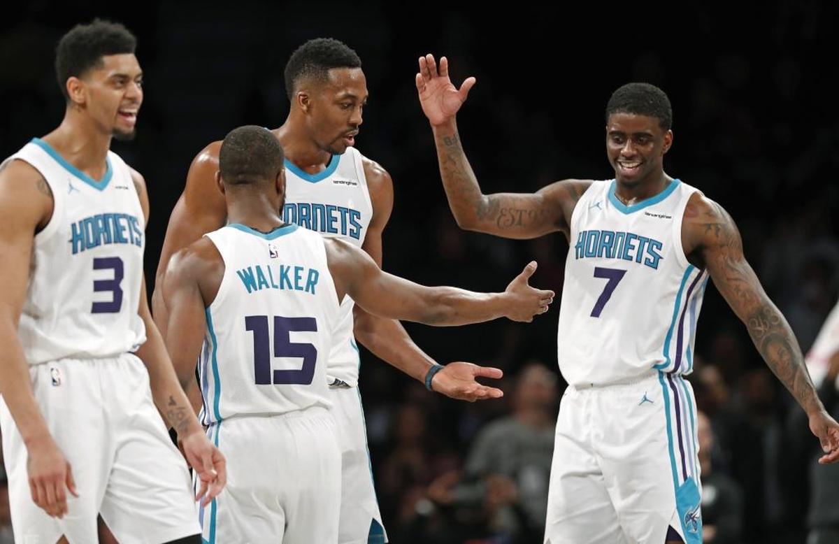 Charlotte Hornets, from left, Jeremy Lamb, Kemba Walker, Dwight Howard and Dwayne Bacon celebrate in the waning seconds of Wednesday’s come-from-behind win against the Brooklyn Nets. That game reinforced coach Steve Clifford’s growing faith on Bacon’s readiness.